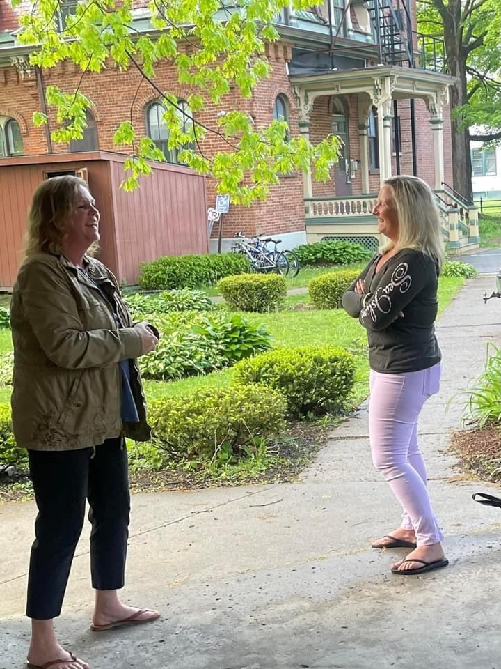 Two women chatting outside