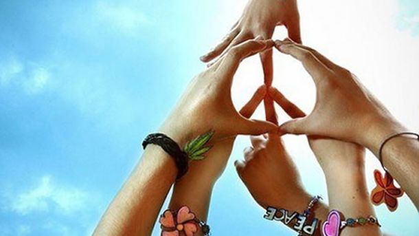 Hands creating a peace sign