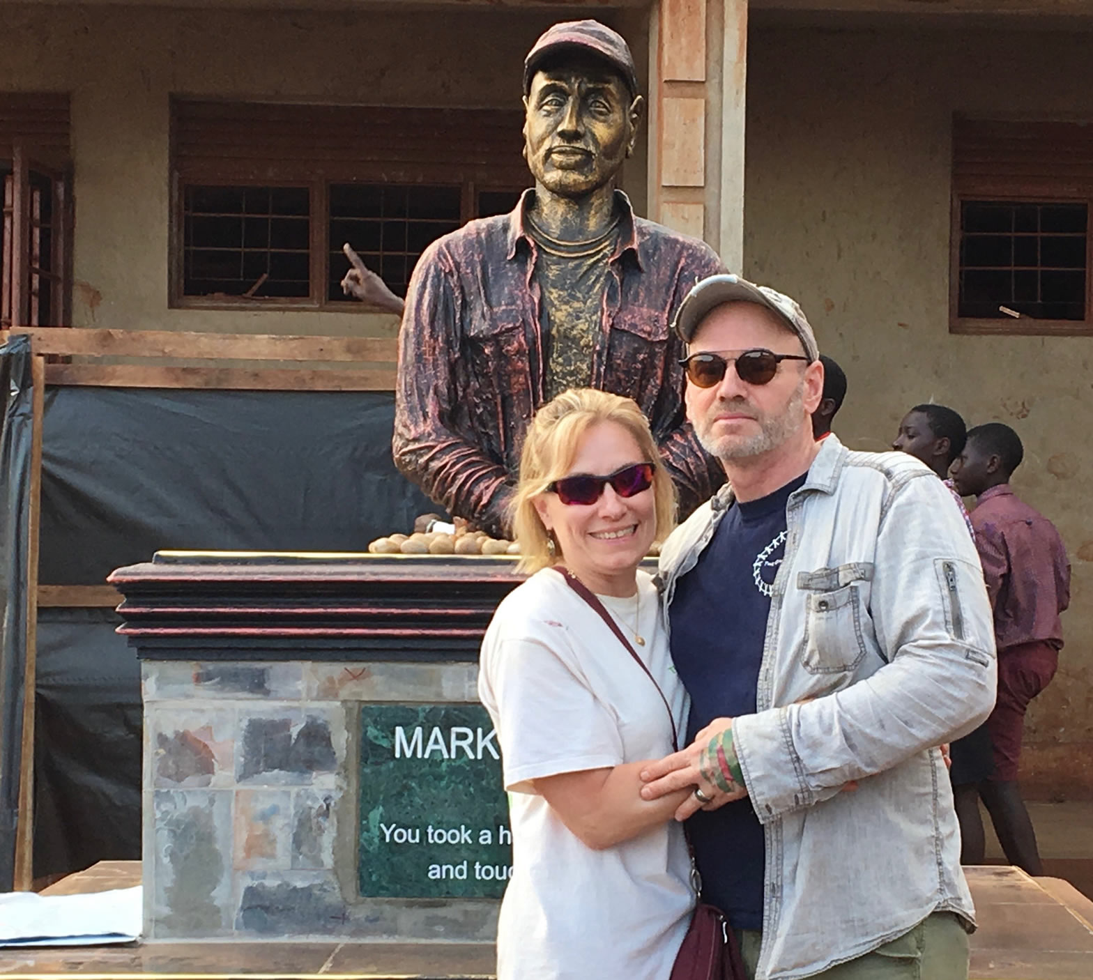 Mark and Kelly in front of statue of Mark